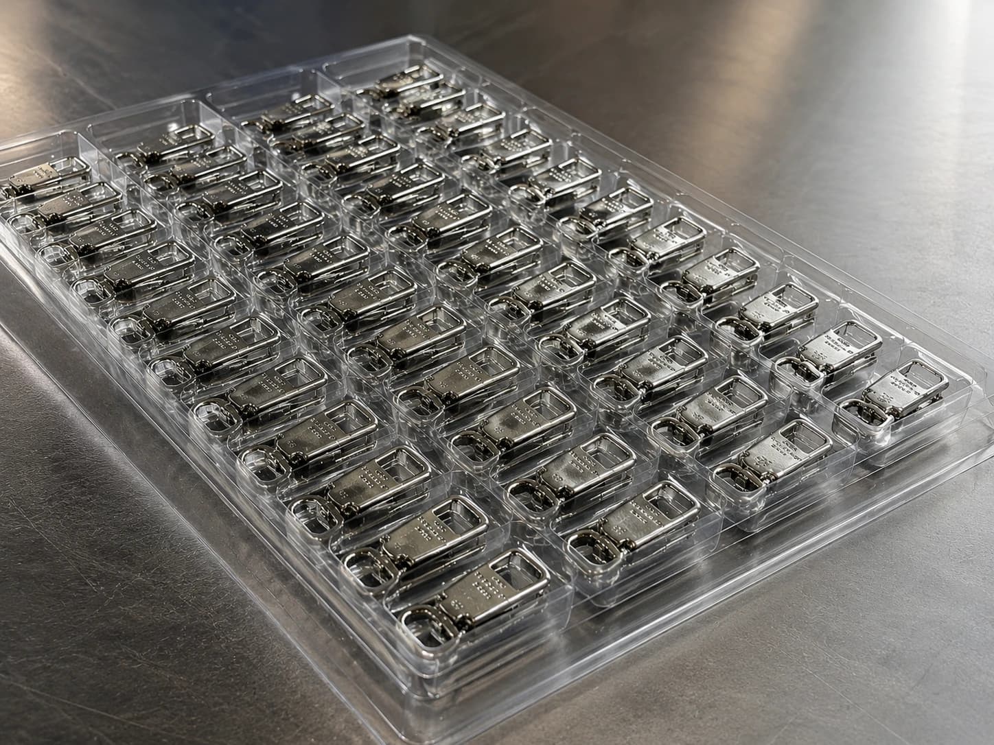 Prepared metal accessories arranged for inspection and delivery